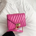 Quilted crossbody bag in vibrant rose pink with gold chain strap and metal lock - Pink