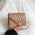 Women's khaki crossbody bag featuring V-shaped quilting and gold chain strap detail - Khaki