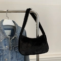 Fashionable black faux fur shoulder bag with soft plush texture for winter style - Black