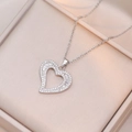 Silver hollow heart pendant necklace with shimmering zircon stones on satin jewelry box - Baguette Zirconia Hollow Heart Style (X1545) / Steel