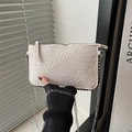 Detail of white woven texture crossbody bag with silver chain and side rivets - White