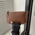 Detail shot of brown embossed faux leather bag with silver chain strap and beaded trim - Brown