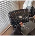 Classic black quilted crossbody bag with golden chain strap and metallic twist lock - Black