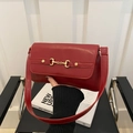 Fashionable burgundy leather underarm shoulder bag with elegant gold horsebit buckle - Red