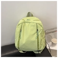 Detalle de la mochila de nailon verde claro con bolsillos verticales con cremallera - Verde