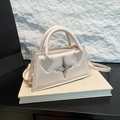 Cream white leather crossbody bag with silver star metallic detail and top handles - White