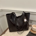 Minimalist dark brown soft leather tote bag with a baseball charm on a cozy beige mat - With Ornament / Brown