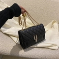Black quilted small square bag with gold U-shaped lock and adjustable chain strap - Black