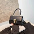 Classic black PU leather handbag with golden T-lock clasp and detachable shoulder strap - Black