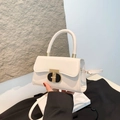 Elegant white leather crossbody bag for women featuring a stylish gold metal twist lock - White