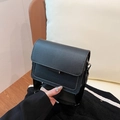 Modern black crossbody square bag with matte leather and wide fabric shoulder strap - Black