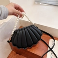 Elegant black quilted shell-shaped handbag with pearl handle and leather crossbody strap - Black
