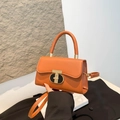 Structured caramel faux leather handbag with a round gold lock and detachable strap - Brown