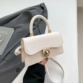 Cream-colored minimalist leather handbag with gold rotating buckle and detachable strap - White