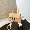 Elegant beige rectangular handbag with golden T-lock and adjustable shoulder strap - Khaki