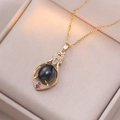 Elegant gold pendant necklace with black gemstone and pink zircon accents in a gift box - Temperature Sensing Flower Style (X2325)