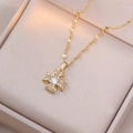 Gold vintage flower zircon necklace featuring a crystal cross bow pendant on a box - Gold Zirconia Flower Style (X2379)
