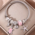 Bracciale con ciondoli a stella marina rosa, tartaruga e perline su scatola regalo - Rosa