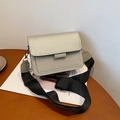 Champagne glitter square crossbody bag with wide canvas strap in side view display - Silver