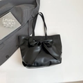Black PU tote bag with a large bow detail and slim double handles for commuting - Black