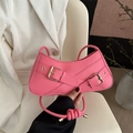 Pink crescent underarm bag with decorative double straps and gold buckles - Pink