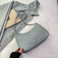Light blue denim texture crescent shoulder bag with silver chain strap and casual style - Blue
