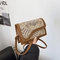 Brown crossbody bag with ethnic cloud embroidery and wave-shaped flap design - Brown