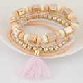 Mehrlagiges Boho-Perlenarmband Set mit rosa Quasten und goldenen Akzenten - Rosa