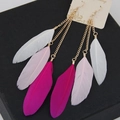 Close-up of bohemian long tassel earrings with white, pink, and rose red feathers - Multicolor + Rose Red