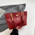 Deep red woven tote bag with golden deer charm and elegant metallic chain handles - Red