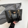 Chic black woven tote bag with deer charm and gold chain strap for minimalist fashion - Black