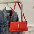 Bright red minimalist square baguette bag with gold metal buckle on denim jacket - Red