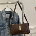 Dark brown minimalist leather crossbody bag with golden metal buckle and adjustable strap - Brown