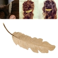 Elegant metal feather hair clip for women available in gold and silver finishes - Gold