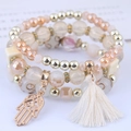 Multilayer beaded bracelet set with Hamsa hand charm, tassels, and champagne gold crystal beads - White Hamsa Hand Style
