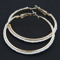 Fashionable large gold-toned beaded hoop earrings with white seed beads in boho style - White