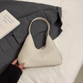 Beige woven hobo bag for women with minimalist shoulder strap and metal feet - Beige