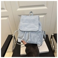 Detail of light blue mini backpack with crinkled texture fabric and drawstring closure - Blue