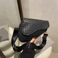 Fashionable black woven saddle bag with triangular silhouette and wide shoulder strap - Black