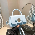 Light blue faux leather crossbody bag with round metal buckle and detachable strap - Blue