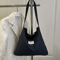 Sac fourre-tout en denim bleu foncé avec cordon de serrage et bandoulière réglable - Bleu