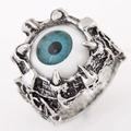 Macro shot of punk gothic ring featuring a realistic blue eye and silver claw detail - Blue