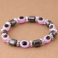 Close-up of pink evil eye beads and grey hematite cylinders on an elastic bracelet - Pink (015072663)