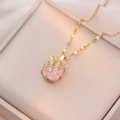 Elegant gold titanium necklace featuring a pink flower zircon pendant in a jewelry box - Pink