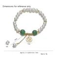 Bracciale di perle barocche con ciondolo Fu dorato e perle di agata verde su bianco - Bracciale di Perle con Carattere Fu