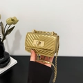 Mini gold crossbody bag with V-shaped quilting and elegant metal chain strap - Gold