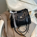 Elegant black faux leather tote bag with lace bow and golden chain strap for women - Black