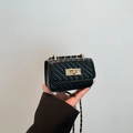 Mini black quilted leather handbag with gold chain strap and rectangular turn-lock - Black