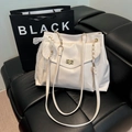 Cream white tote bag with chain strap, metal twist lock, and lace bow detail - White