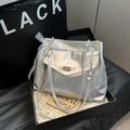 Chic silver chain shoulder bag with gold clasp and elegant white lace bow charm - Silver
